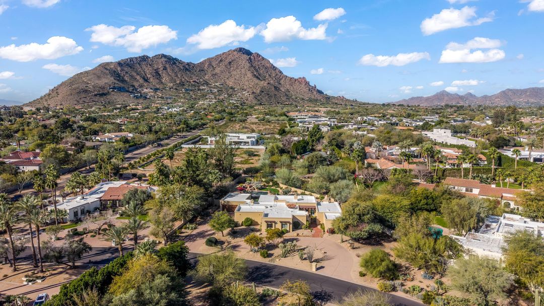 Aerial over Paradise Valley toward Camelback Mountain on a clear day