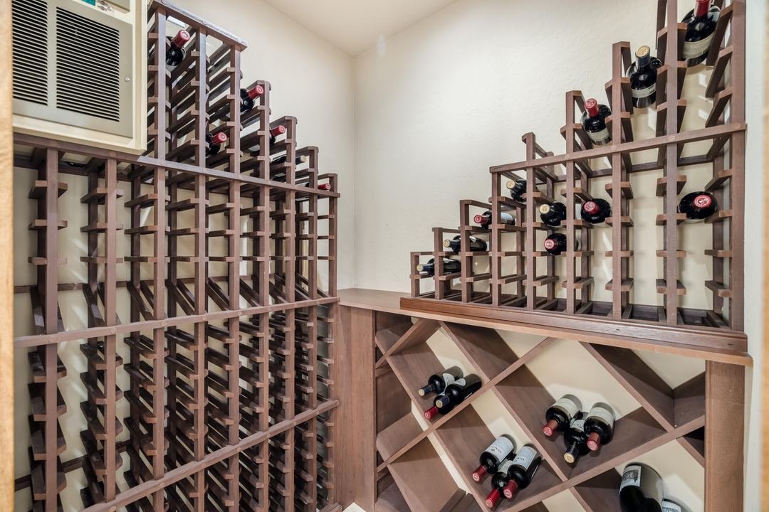 Walk-in wine room with floor-to-ceiling wood racks