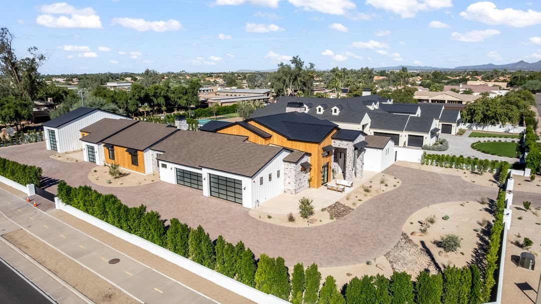 Aerial of a modern farmhouse on a large Scottsdale lot with a sport court and pool