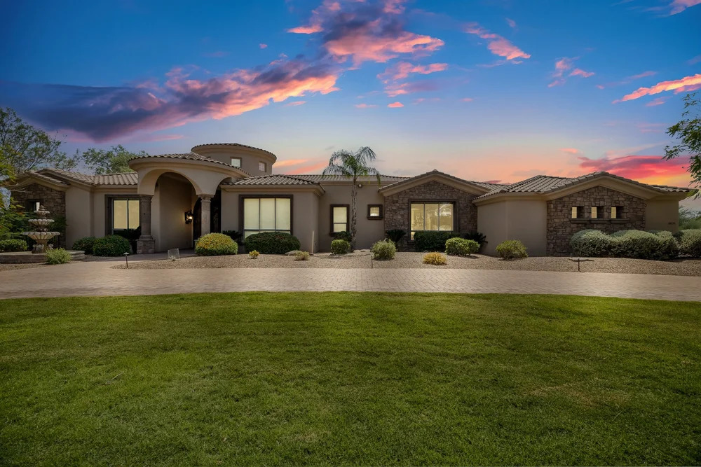 Real estate twilight photography of a luxury home exterior at dusk in Phoenix, AZ
