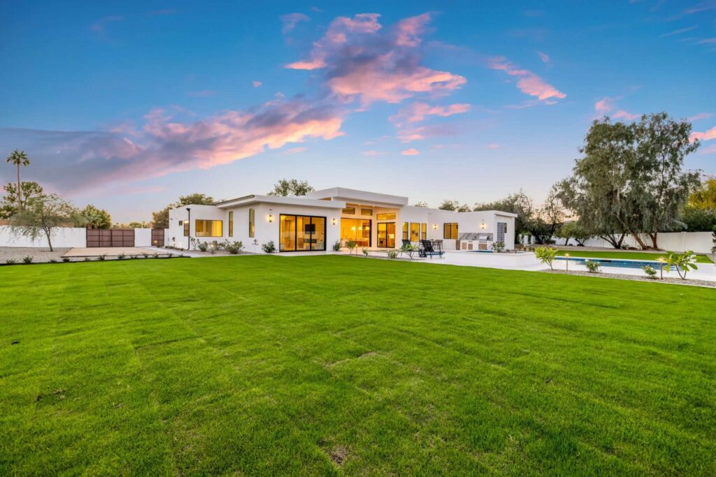 Twilight Real Estate Photography of Backyard Pool and Lawn in Chandler, AZ