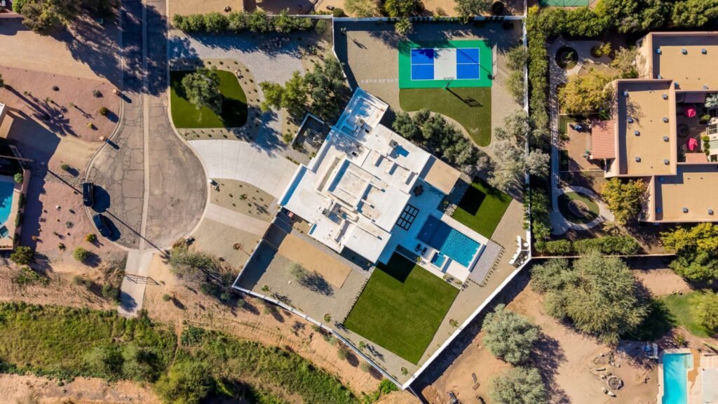 Top-down real estate drone aerial photography of a Phoenix, AZ property with a pickleball court and pool