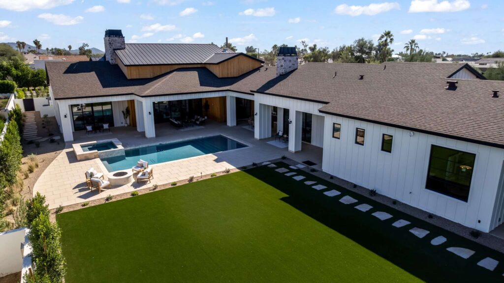 Aerial view of covered patio and pool at custom home in Mesa, AZ
