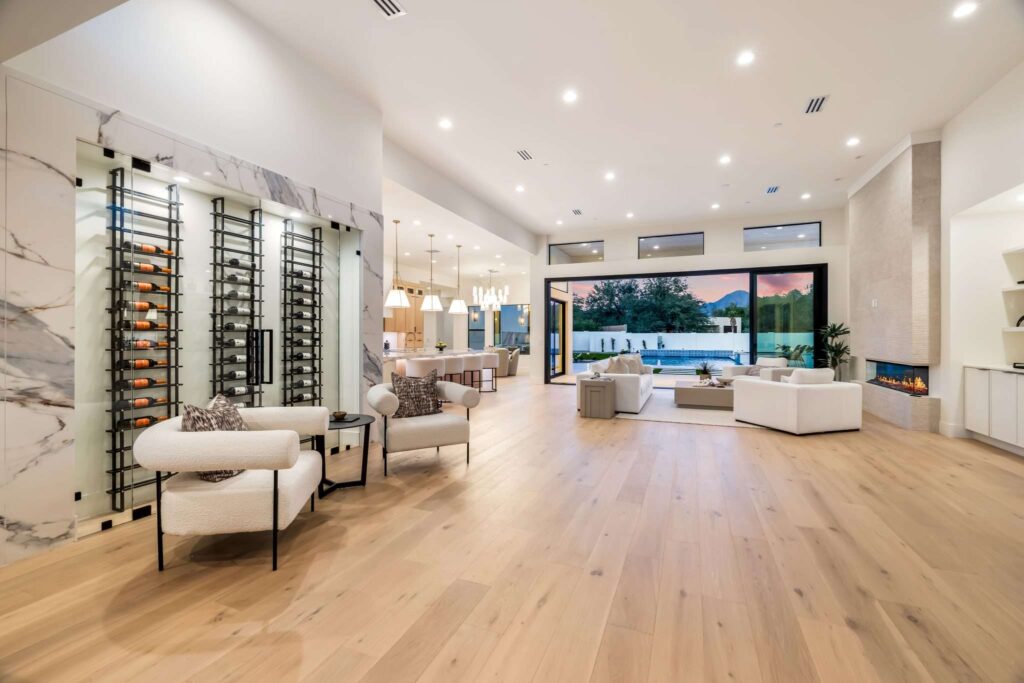 Showcase Properties with Expert Real Estate Videography in Scottsdale, AZ 2 Real estate videography in Scottsdale AZ showing open-concept luxury living room with custom glass wine cellar