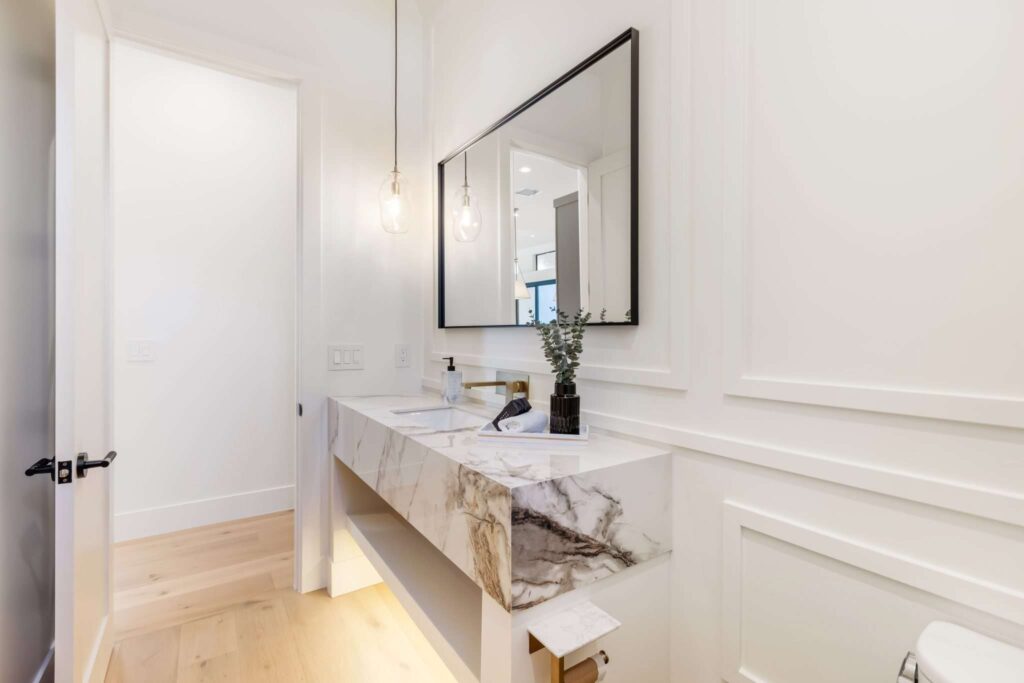 Interior real estate photography of a modern bathroom with a marble vanity in Phoenix, AZ