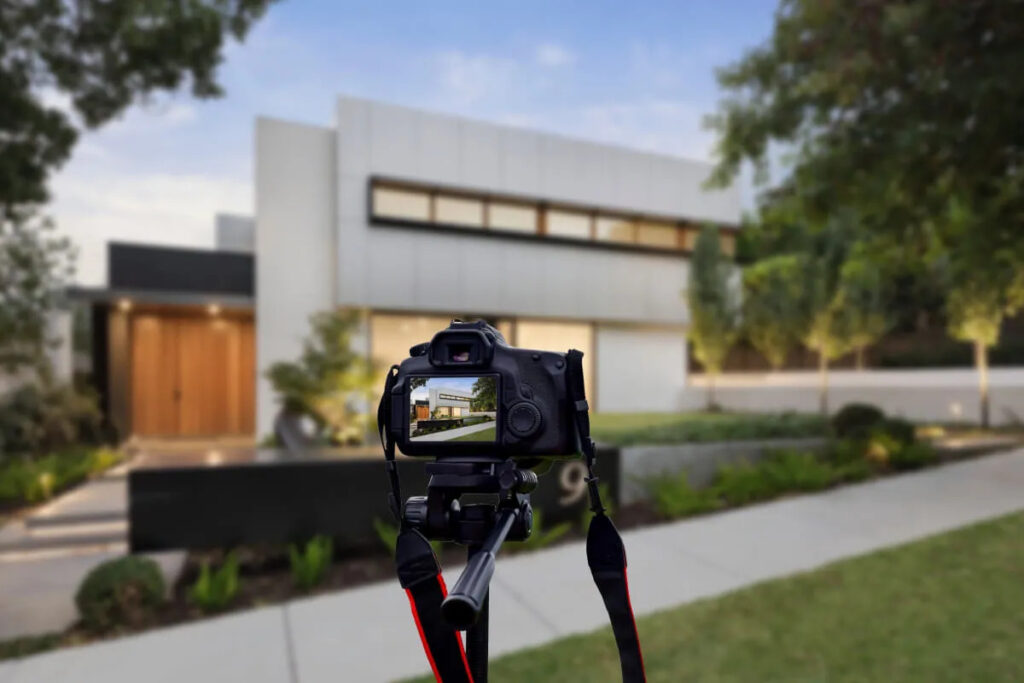 Showcase Properties with Expert Real Estate Videography in Scottsdale, AZ 5 Professional real estate photography camera on tripod shooting modern home exterior in Scottsdale AZ